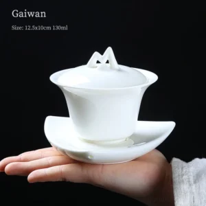 full view of unique modern white porcelain gaiwan with mountain lid knob and leaf base