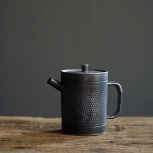 vintage black chinese teapot full view handcrafted ceramic with built-in infuser
