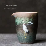 Full product shot of hand-painted vintage ceramic crane gong dao bei tea pitcher