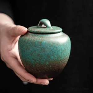 hand holding vintage gradient ceramic tea canister, 10.1oz sealed tea storage