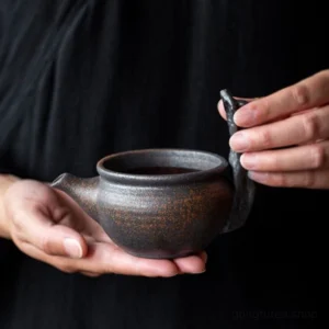 vintage coarse pottery gong dao bei tea pitcher with branch handle dark brown