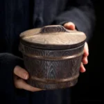 full view of vintage dark brown ceramic loose tea canister tea canister