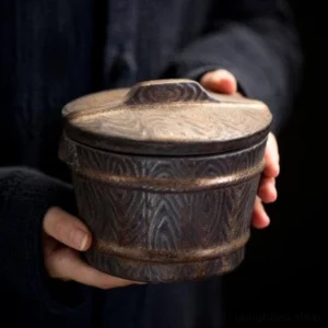 full view of vintage dark brown ceramic loose tea canister tea canister