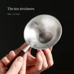 vintage hammered tin tea strainer spoon with dark wood handle