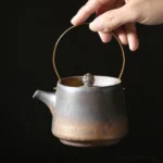vintage oxidized metal glaze chinese teapot with brass handle full view