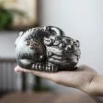 front view of vintage hand carved pixiu tea pet chinese auspicious tea table decor