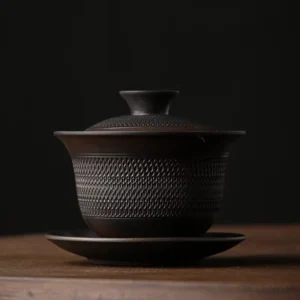 full view of handcrafted textured vintage dark ceramic chinese gaiwan