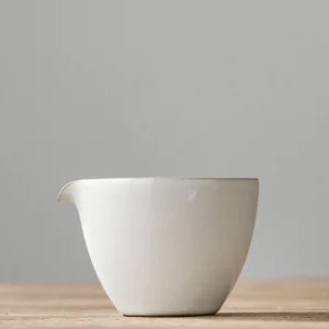 Handmade white ceramic Gong Dao Bei fairness tea pitcher with tan trim
