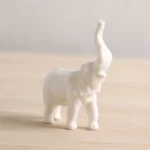 handcrafted white porcelain elephant tea pet style a raised trunk decorative tea companion