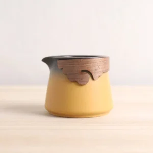 yellow gradient ceramic gong dao bei tea pitcher with carved wooden grip front view