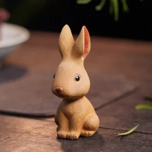 Handcrafted Yixing Zisha rabbit tea pet on wooden tea table
